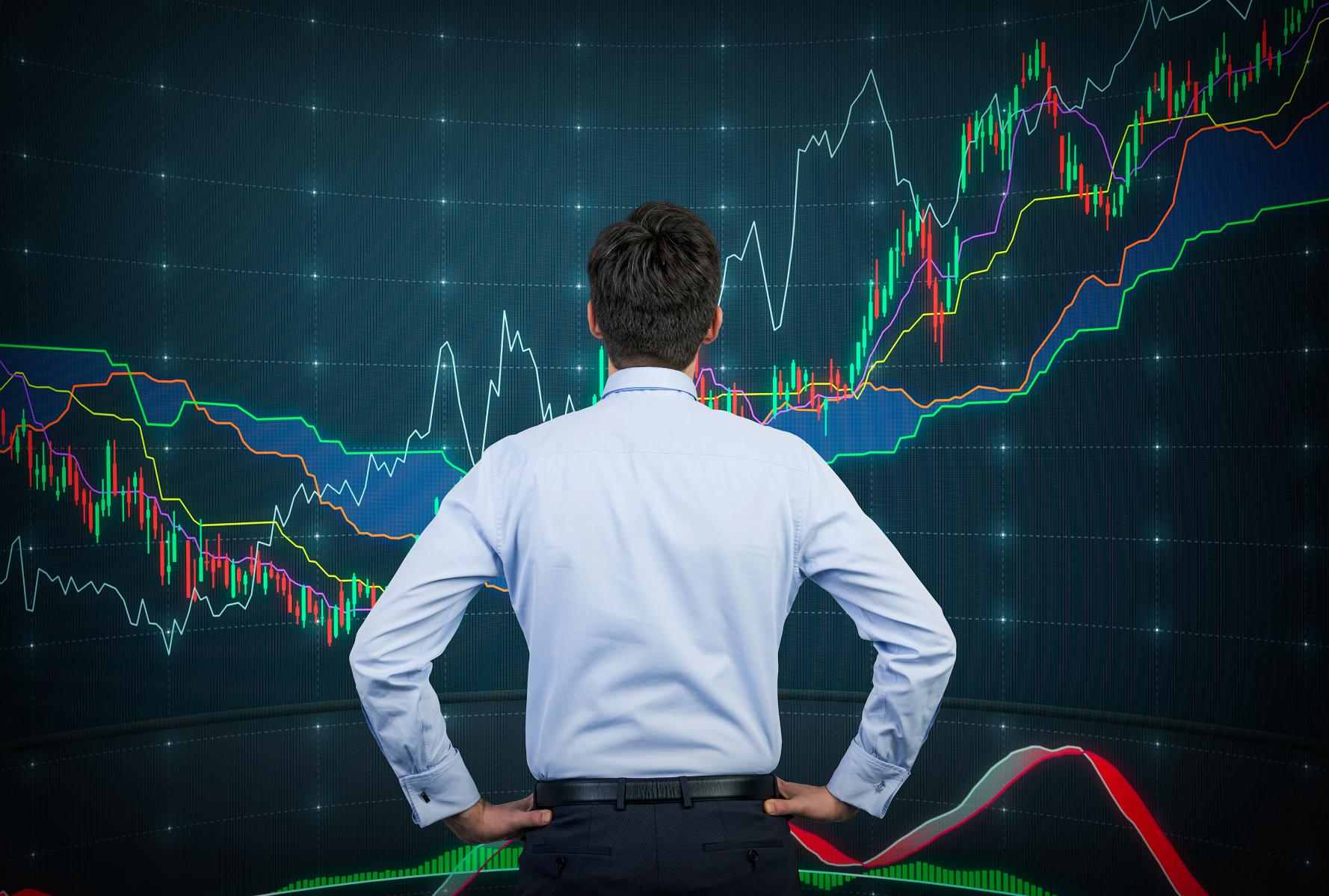 man looking at stock market